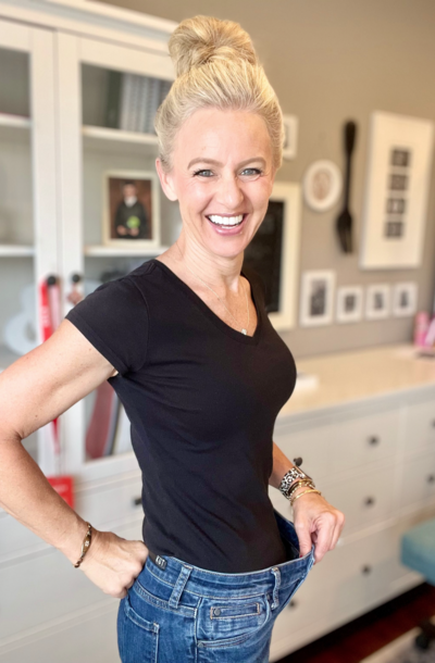 Woman in jeans after weight loss