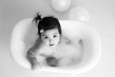A baby is posed on a moon pillow for a photoshoot in Vancouver