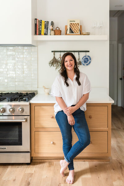 Madison Dearly in a kitchen smiling at the camera