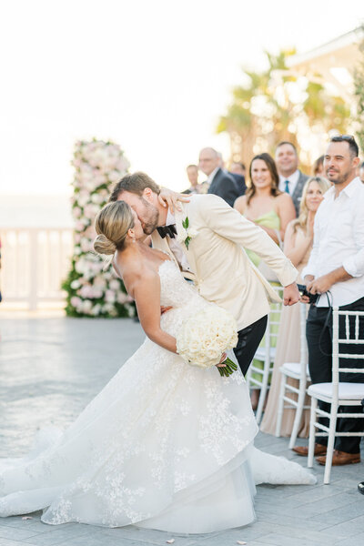 Bride and groom share a kiss as they walk back down the isle at their Shutters on the beach wedding in Santa Monica. Taken by Los Angeles wedding photographer Rachel Paige photography