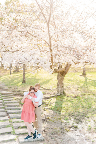 Newlyweds Mark and Emily underneath Carrigan Farms' willow tree captured by Charlotte NC wedding photographer