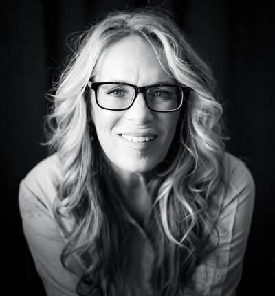 self portrait of photographer in black and white.  Wearing glasses