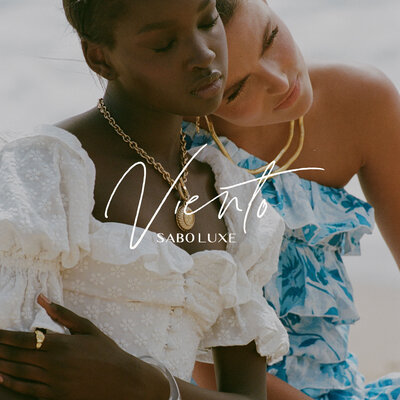 2 women embracing with logo on top