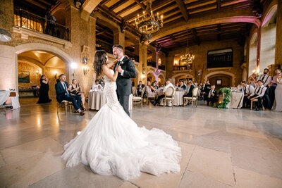 The bride and groom share an unforgettable first dance in the historic Mount Stephen Hall at the Fairmont Banff Springs, surrounded by grandeur and timeless romance.