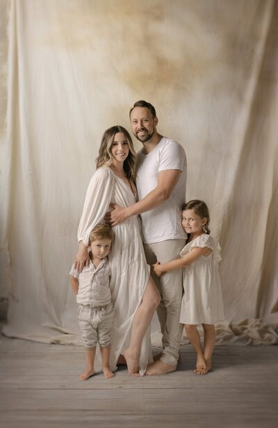 Studio family portrait with soft backdrop photographed by West Michigan family photographers
