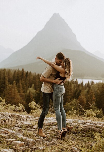 Couple hugging in on hiking trail