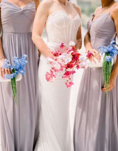 Wedding bouquet flowers and floral bridesmaid clutch designed by Snapdragon Bloom Bar in Phoenix Arizona
