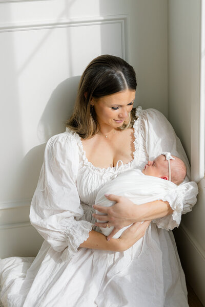 mother holding newborn baby