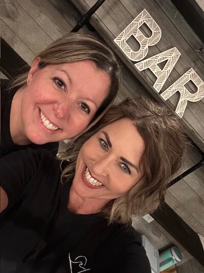 emma fixing flowers at a wedding