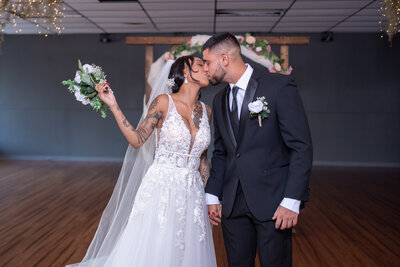 Romantic newlywed couple in a stunning indoor venue, Clearwater, Florida - Creating memories in a picturesque destination setting.