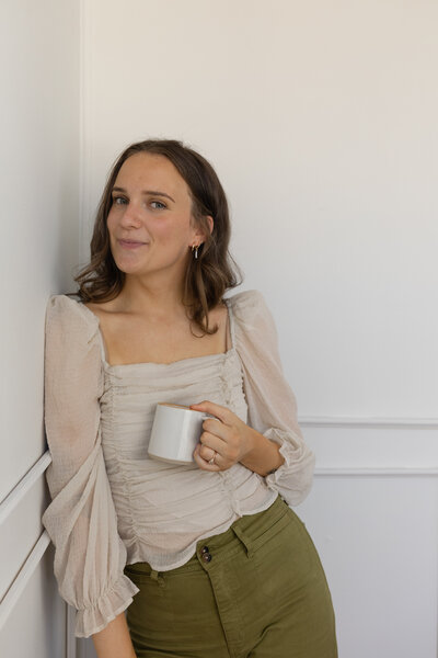 Creative Freelance Designer woman with hands on hips.