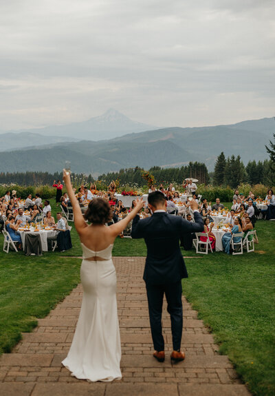 couple entering reception for wedding