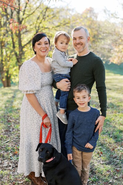 Dolly-of-Dolly-DeLong-Photography-With-Her-Two-Boys-and-Husband-and-Dog-For-Family-Photos