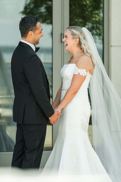 candid wedding photo of bride and groom laughing at The Edgewater wedding in Madison, WI