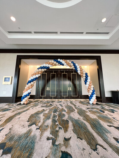 blue, white, and gold balloon arch