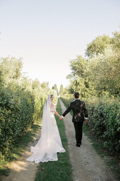 Bride and groom walk up memorial steps at their DC wedding