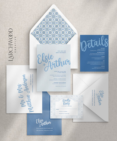 The Isadora 5-piece semi-custom wedding invitations suite — a design in blues with bold modern handwritten script and Mediterranean flair.