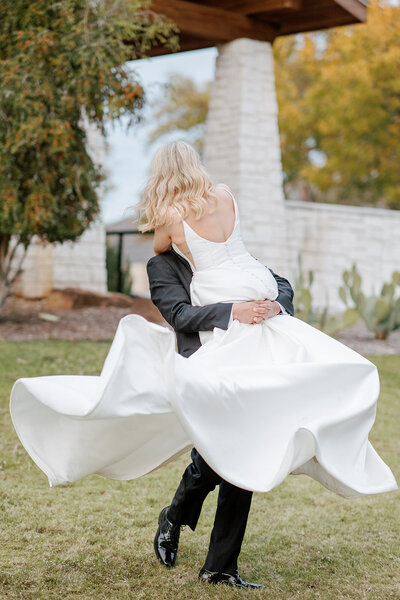 bride and groom standing in the lawn