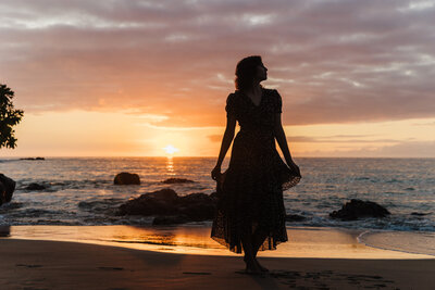 beach silhouette of girl at sunset