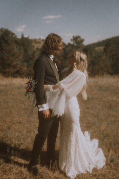 bride hugs groom in intimate elopement photo