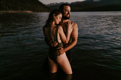 Couple in bathing suits embracing in Lake Dillon CO