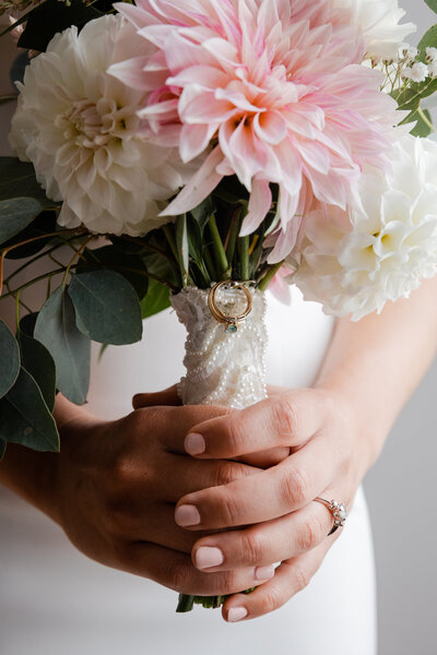 Closeup of a bouquet in a brides hands.