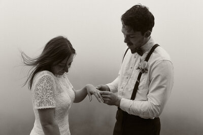 Couple dances in the shadows under a gazebo in Northeast Kansas City, Missouri.