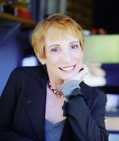 Staff headshot in front of neutral background.