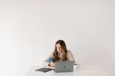 Woman typing on a laptop