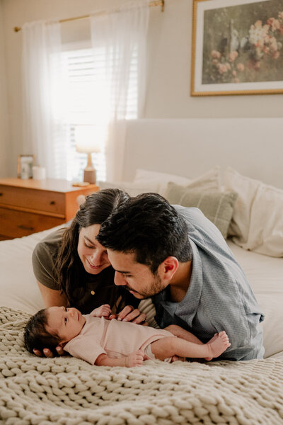 Newborn held by parents in Northern Colorado