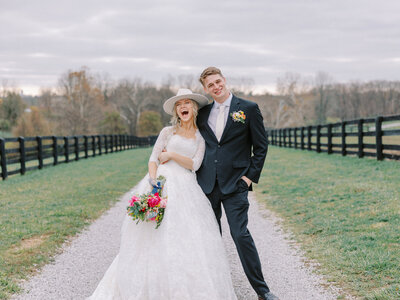 Bride and Groom in a field at Verona Vineyards in Verona, KY