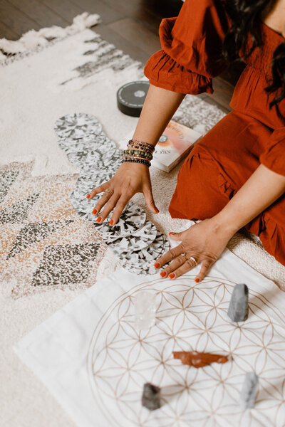 Mindfulness coach Radhika arranging crystals