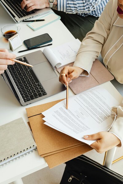 Woman with Macbook working on a customized plan