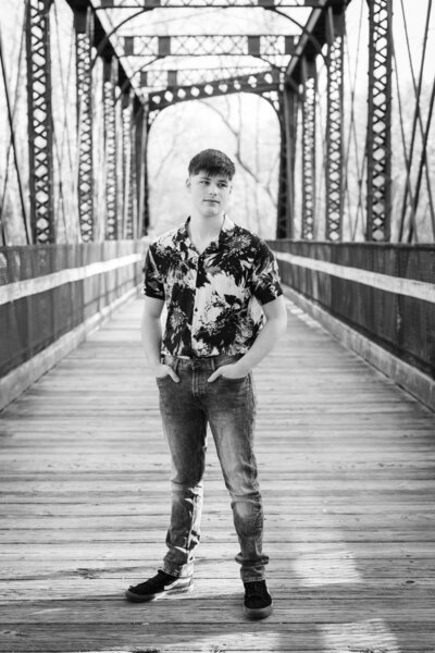 highschool-senior-boy-black-and-white-bridge