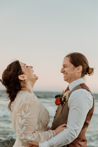 Photograph of couple embracing  at Folly Beach outside of Charleston