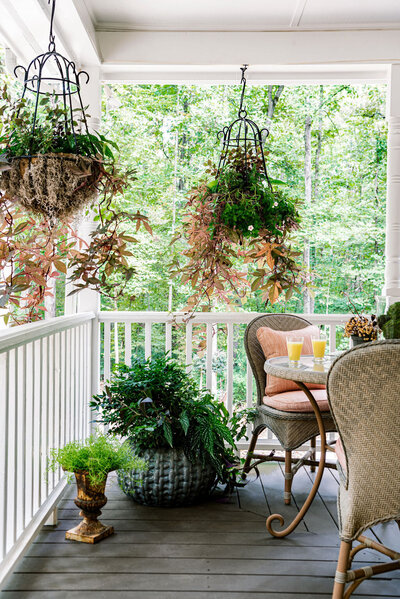outdoor living designers, wicker chair, container garden in a basket