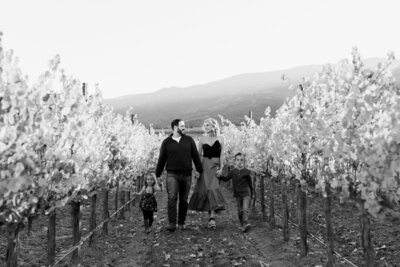 Family walking the vineyards of the Santa Lucia Highland