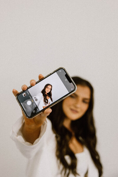 Brunette woman taking a selfie