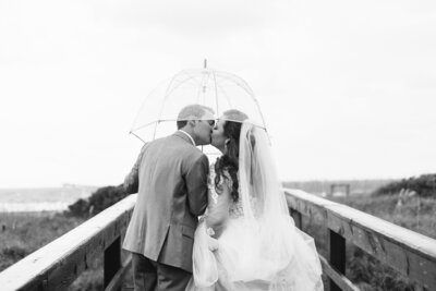 a groom dips his bride during their Savannah engagement photos