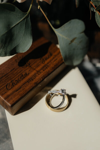 Elevated wedding styling details with florals, rings, and heirloom touches.