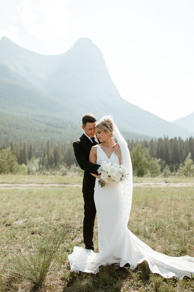 Couple cutting their cake during their reception at Silvertip Resort in Canmore
