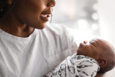 Mother Smiling at Newborn baby