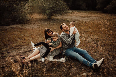 family of four at golden hour during outdoor photoshoot