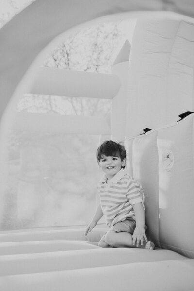 baby smiling in forest