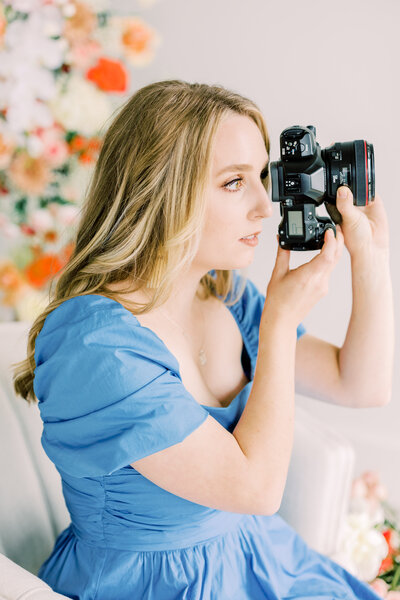 Wedding photographer Rachel Linder looking through a camera