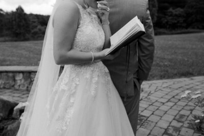 reading vows at an intimate wedding in floyd, virginia