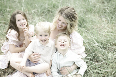 mother and children in a field Asheville Family Photography