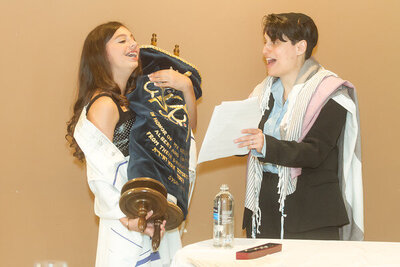 13-year-old-holds-Torah-during-B-mitzah-cermony