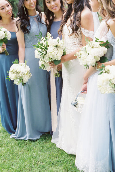 Bride and bridesmaids with their flowers at a wedding in Oregon.