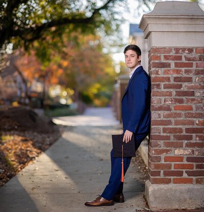 A University of South Carolina student taking his senior portraits on campus